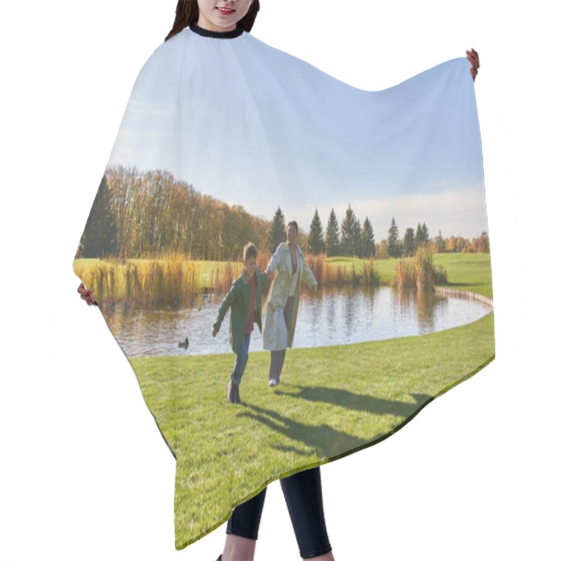 Personality  Playful, Happy African American Mother And Son Running On Grass Near Pond, Modern Parenting, Fun Hair Cutting Cape