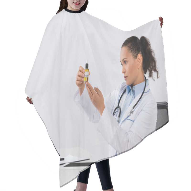 Personality  African American Doctor Holding Cbd Bottle Near Medication And Digital Tablet On Desk Hair Cutting Cape