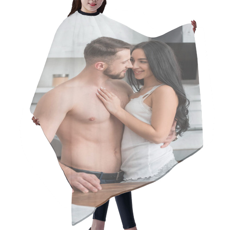 Personality  Happy Woman Hugging Handsome Shirtless Boyfriend While Standing In Kitchen  Hair Cutting Cape