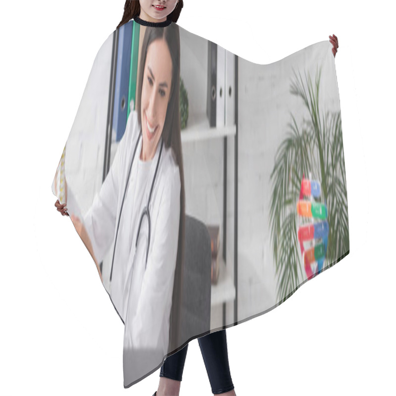 Personality  Cheerful Doctor Holding Spinal Model During Video Call On Laptop In Hospital, Banner  Hair Cutting Cape