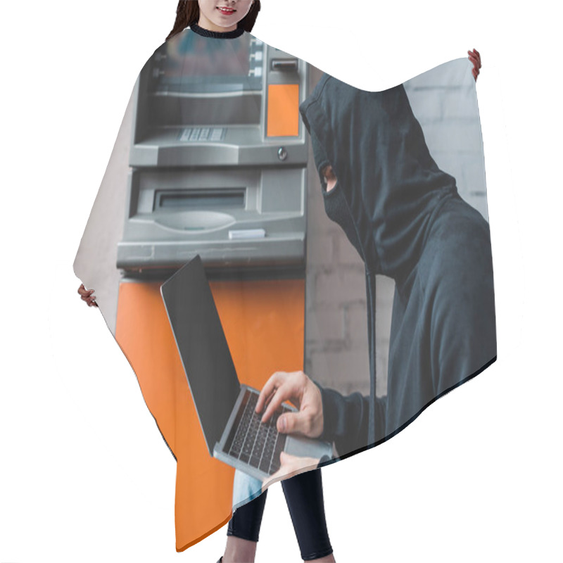 Personality  Side View Of Hacker In Mask Using Laptop With Blank Screen Near Atm  Hair Cutting Cape