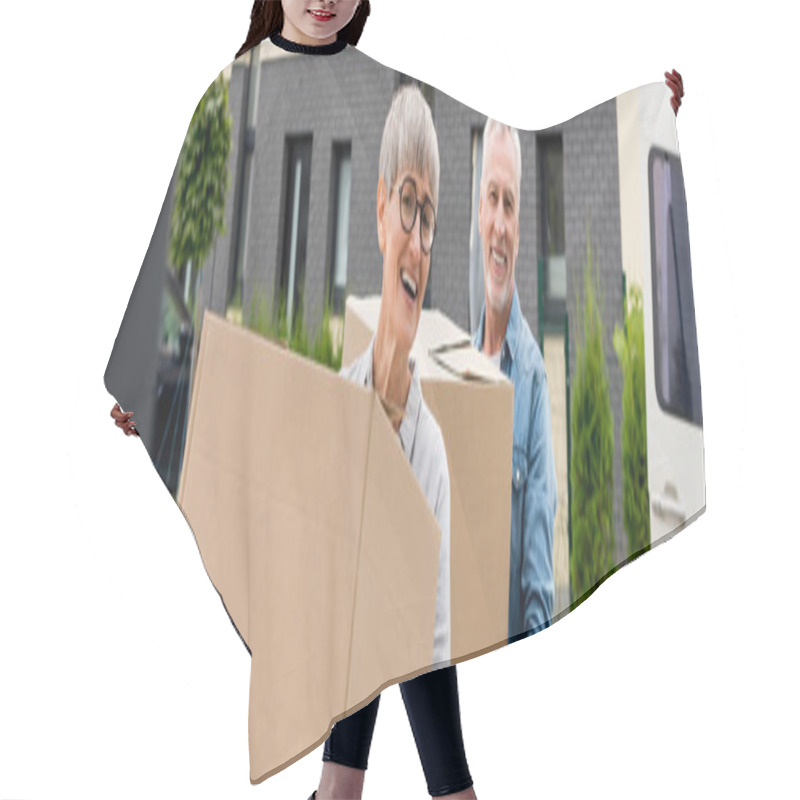 Personality  Panoramic Shot Of Mature Man And Smiling Woman Bringing Boxes To New House  Hair Cutting Cape