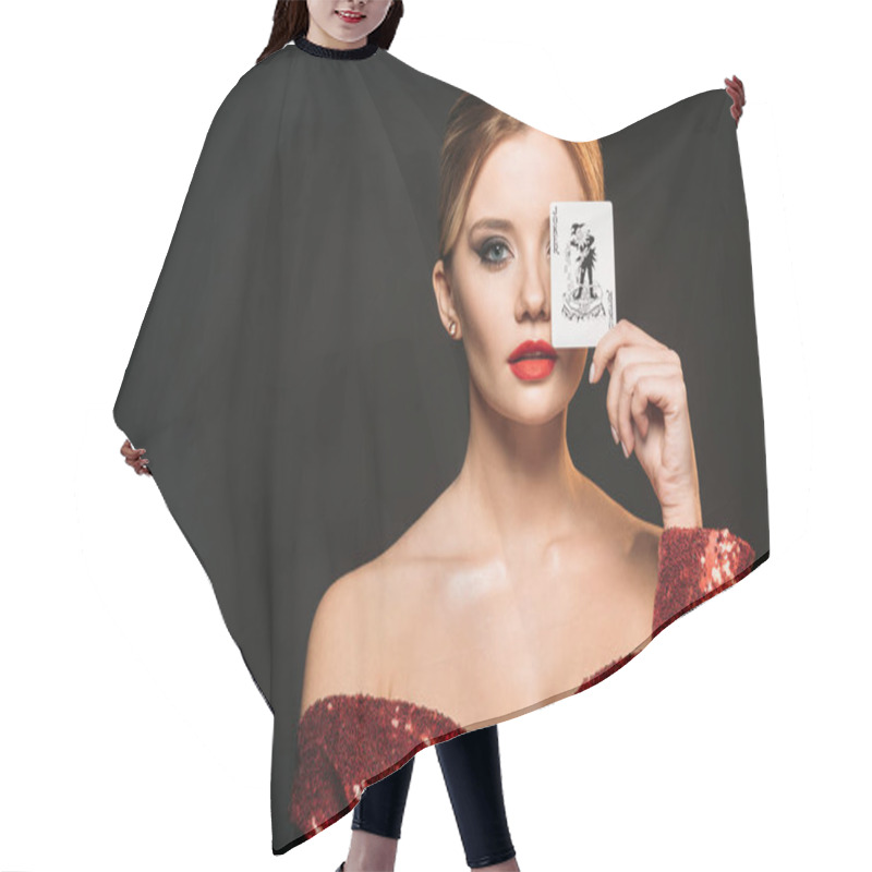 Personality  Attractive Girl In Red Shiny Dress Covering Eye With Joker Card Isolated On Black Hair Cutting Cape