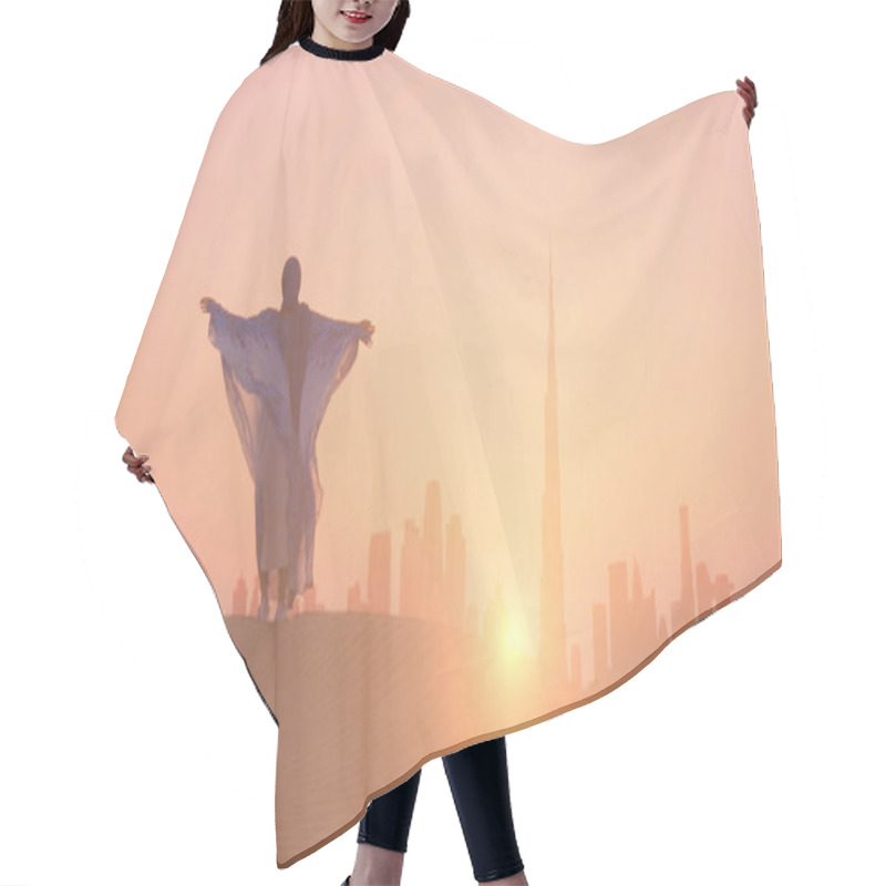 Personality  Arabic Woman Weared In Traditional UAE Dress - Abayain Rising Her Hands On The Sunset At A Desert With Dubai City Silhouette On The Background. Hair Cutting Cape