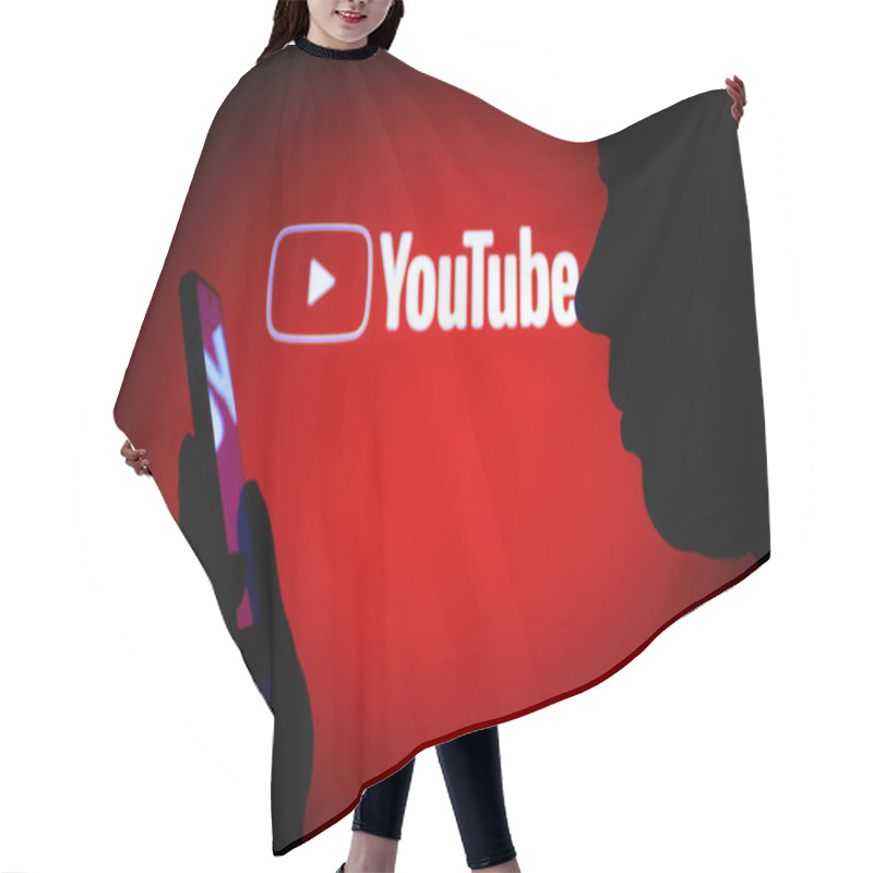 Personality  March 14, 2022, Brazil. In This Photo Illustration The YouTube Logo Seen In The Background Of A Silhouette Woman Holding A Mobile Phone Hair Cutting Cape