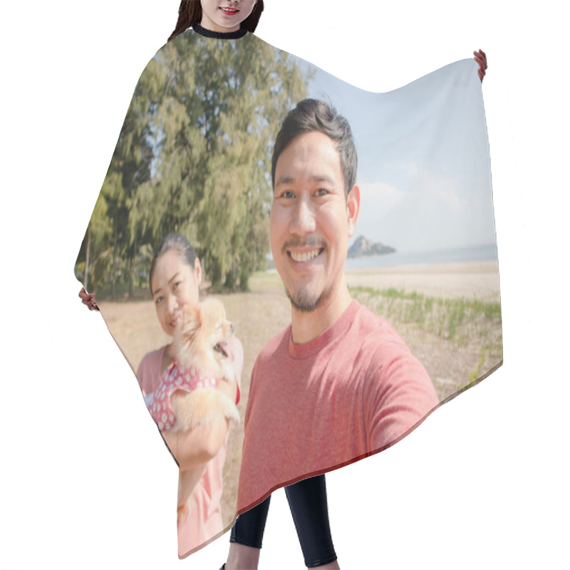 Personality  Happy Asian Couple On The Beach With A Puppy. Hair Cutting Cape