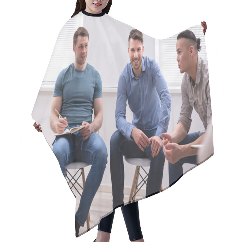 Personality  Smiling Men Looking At Their Male Friend While Discussion Hair Cutting Cape