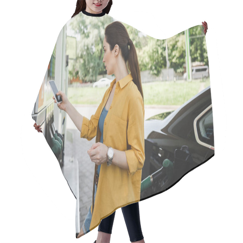 Personality  Woman Holding Smartphone And Credit Card Near Auto On Car Refueling Station  Hair Cutting Cape