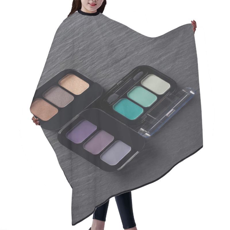 Personality  Set Of Three Eye Shadow Palettes On Dark Slate Background Hair Cutting Cape