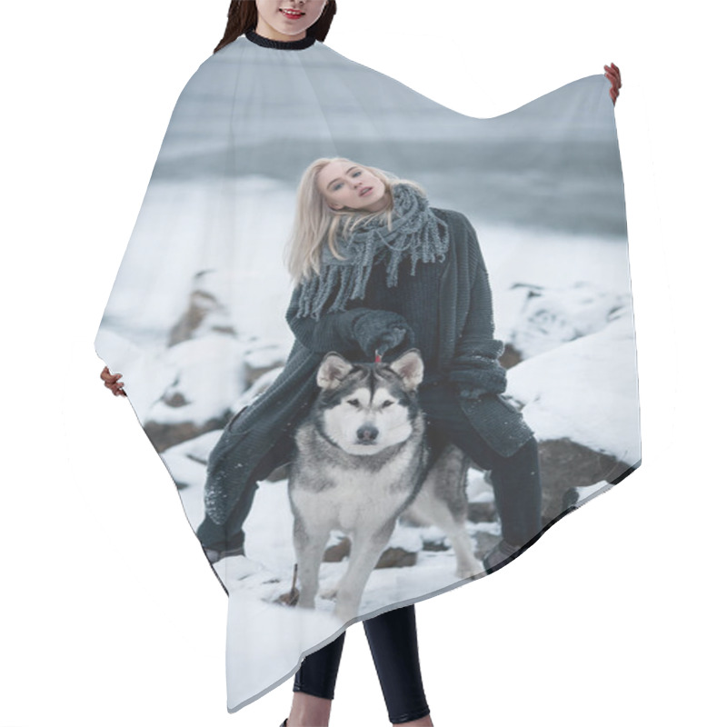 Personality  Girl With Dog Malamute Among Rocks In Winter. Hair Cutting Cape