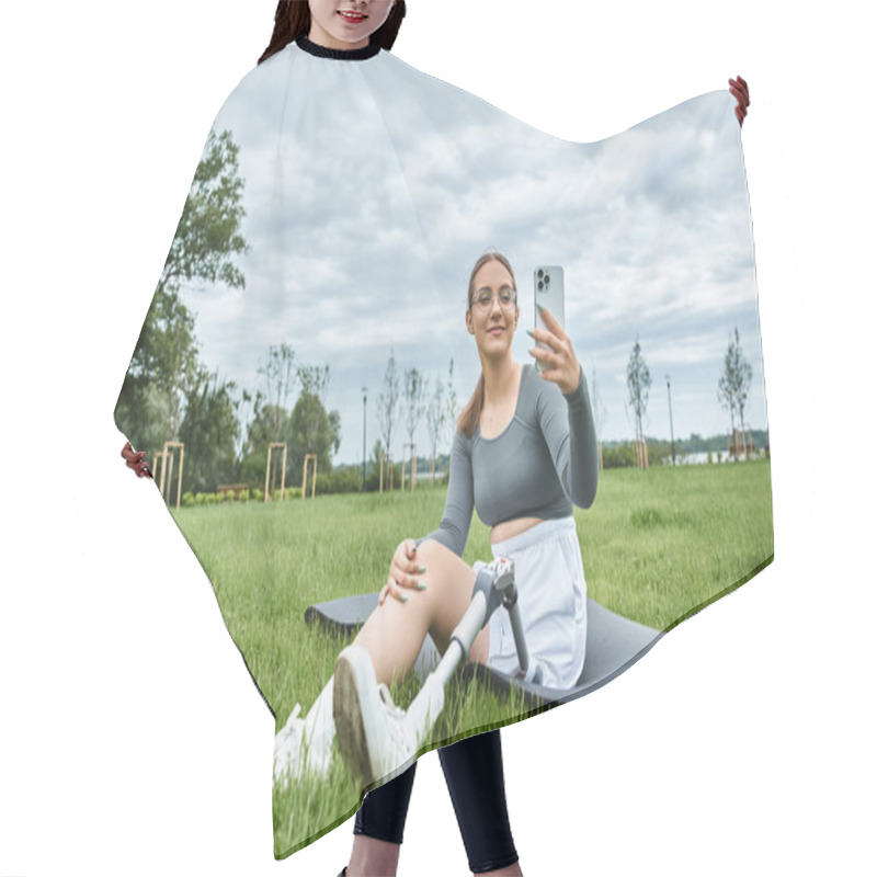 Personality  A Young Woman Relaxes On A Mat, Capturing The Moment Outdoors With Her Prosthetic Leg Visible. Hair Cutting Cape