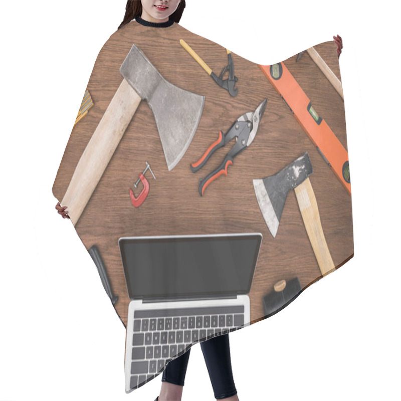 Personality  Top View Of Laptop With Blank Screen Surrounded By Various Tools On Wooden Table  Hair Cutting Cape