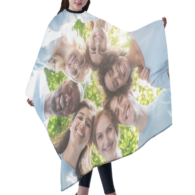 Personality  Happy people standing together, view from below hair cutting cape