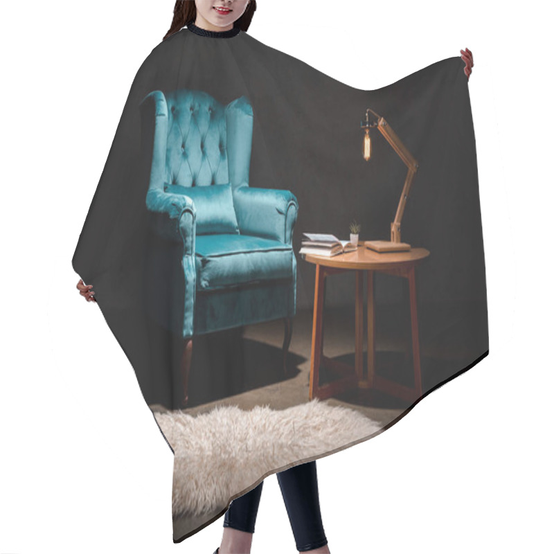 Personality  Elegant Velour Blue Armchair With Pillow Near Animal Skin Rug, Wooden Table And Lamp Isolated On Black Hair Cutting Cape