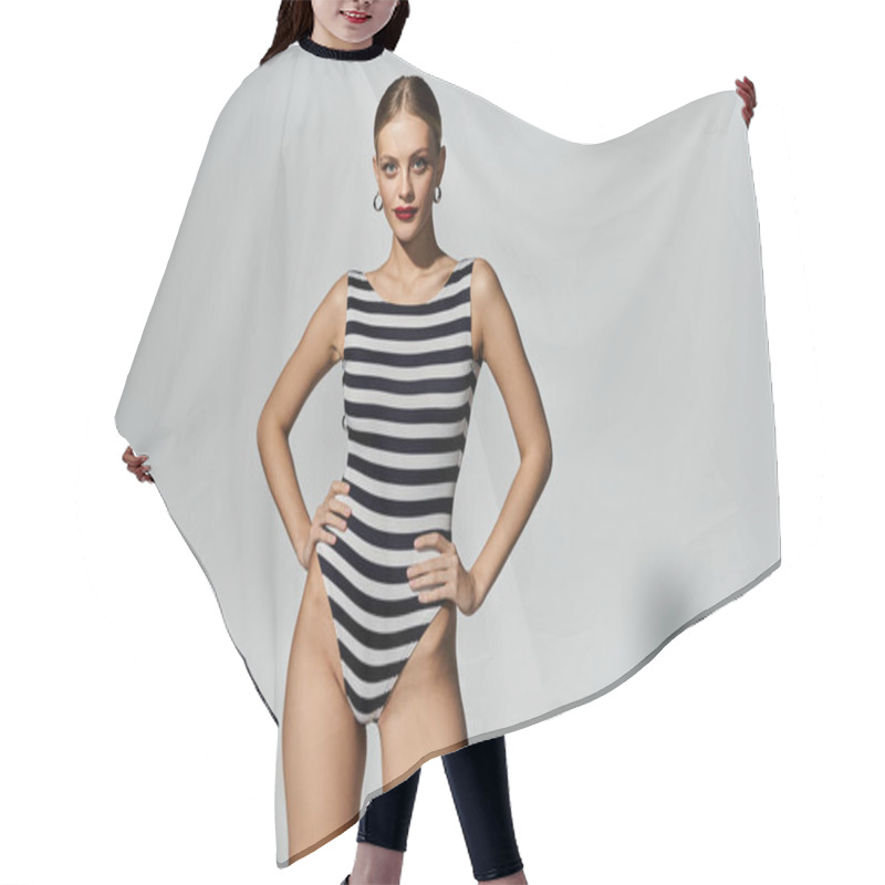 Personality  Stylish Woman Striking A Pose In A Black And White Striped Swimsuit. Hair Cutting Cape