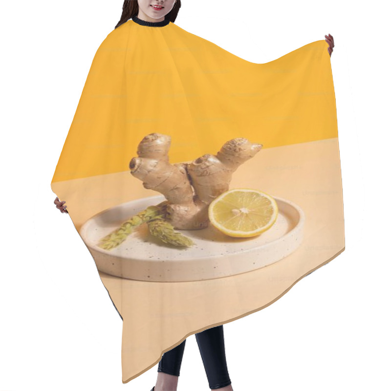 Personality  Fresh Ginger Root And Lemon On A Minimalistic Plate Against A Vibrant Yellow Background. Hair Cutting Cape