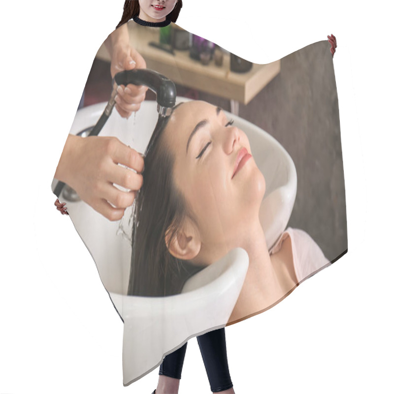 Personality  Young Woman During Washing Of Hair In Beauty Salon Hair Cutting Cape