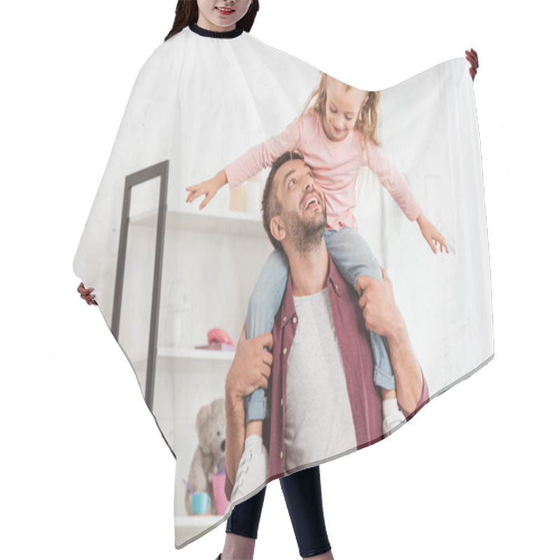 Personality  Daughter Sitting On Fathers Back And Having Fun At Home Hair Cutting Cape