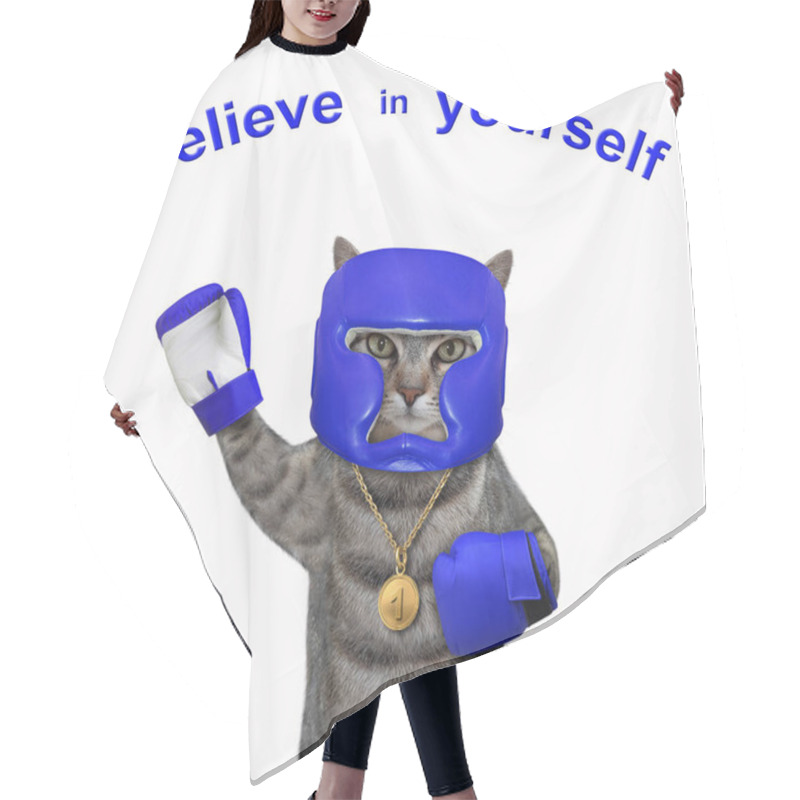 Personality  A Gray Cat Athlete With A Golden First Place Medal Dressed A Blue Boxing Uniform. Believe Yourself. White Background. Isolated. Hair Cutting Cape