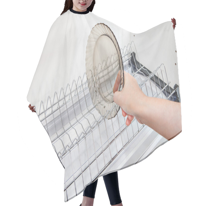 Personality  Close-up Woman Hand Takes Dish From Inside Wire Plate Drainer. Hair Cutting Cape