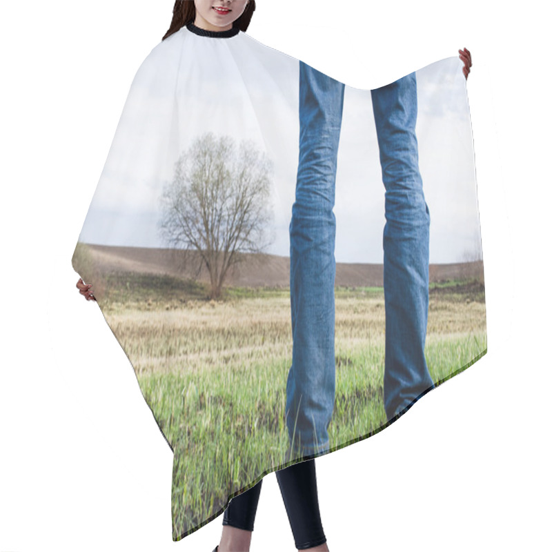 Personality  Man Stands On Burnt Field With Some Remains Of Green Grass And Lonely Tree On It. Nature Background. Hair Cutting Cape