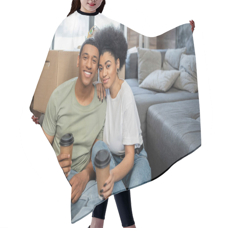 Personality  Smiling African American Couple Holding Coffee To Go Near Carton Box In New Living Room Hair Cutting Cape