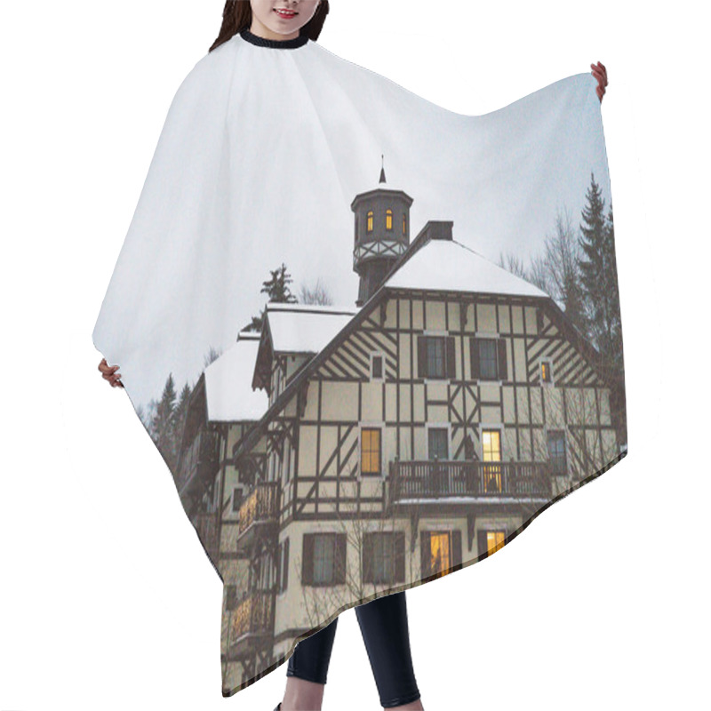 Personality  Spindleruv Mlyn, Czech Republic - January 3, 2025: Scenic View Of A Traditional Alpine-style Hotel Savoy With Snow-covered Rooftops And Warm Glowing Windows, Creating Picturesque Winter Atmosphere. Hair Cutting Cape