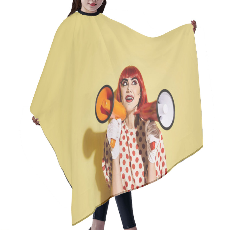 Personality  A Striking Redhead Woman With Pop Art Makeup Holds A Megaphone Against A Vibrant Yellow Background. Hair Cutting Cape