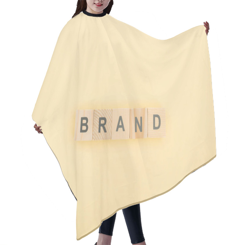 Personality  Top View Of Brand Lettering Made Of Wooden Cubes On Yellow Background Hair Cutting Cape