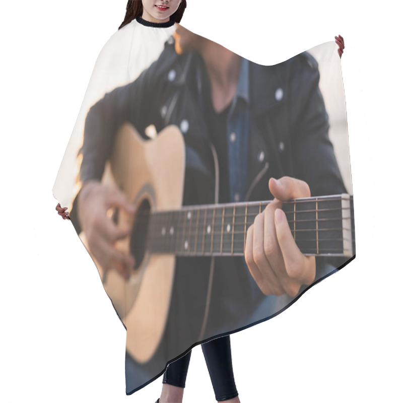 Personality  Cropped View Of Young Man Playing Acoustic Guitar Outdoors  Hair Cutting Cape