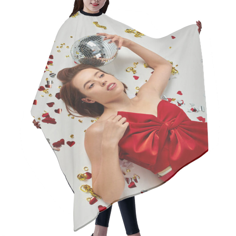 Personality  New Year Party, Young Brunette Woman With Disco Ball Lying On Floor Near Confetti On Grey Backdrop Hair Cutting Cape