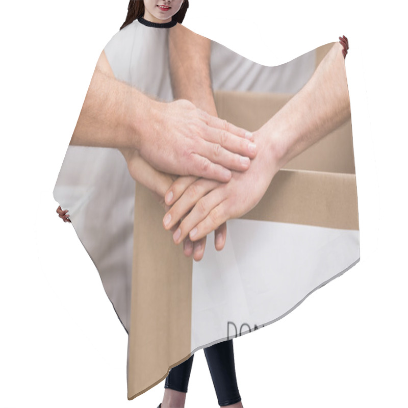 Personality  Volunteer Team Holding Hands On A Box Of Donations Hair Cutting Cape