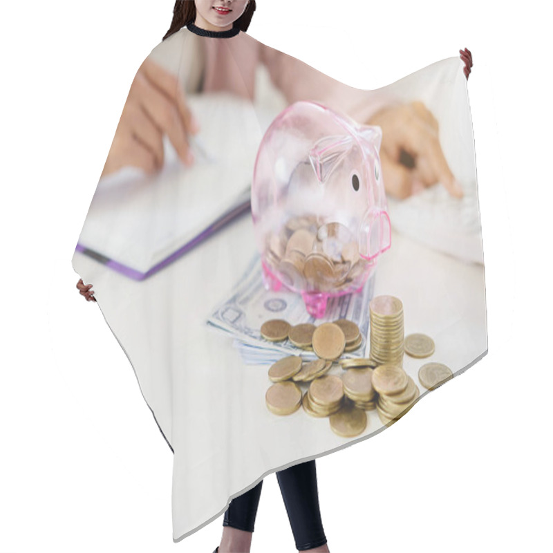 Personality  Business People Sheltering Coins And Piggy Bank At Desk. Saving Concept Hair Cutting Cape