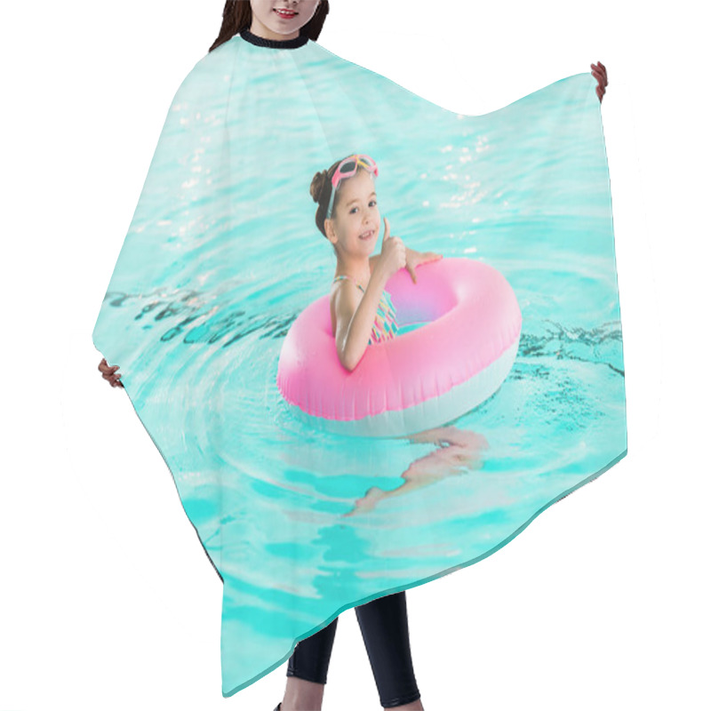 Personality  Happy Kid Swimming With Inflatable Ring And Showing Thumb Up Sign  In Swimming Pool Hair Cutting Cape