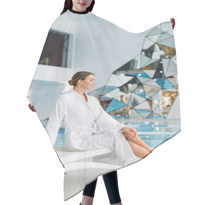 Personality  Side View Of Pleased Young Woman In White Bathrobe Sitting On Deck Chair In Spa Center Hair Cutting Cape