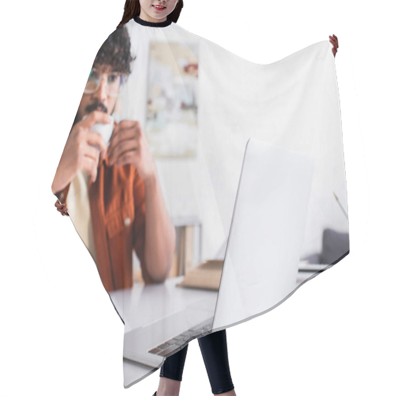 Personality  Laptop Near Blurred Indian Copywriter With Cup At Home  Hair Cutting Cape