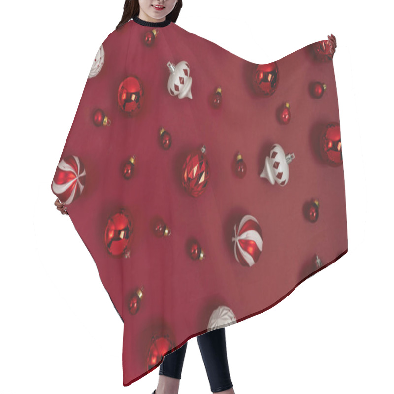 Personality  Christmas Pattern Made Of Glitter Red Balls Tree Toys Decoration On A Red Background With Copy Space. New Year Greeting Card Layout. Flat Lay. Hair Cutting Cape