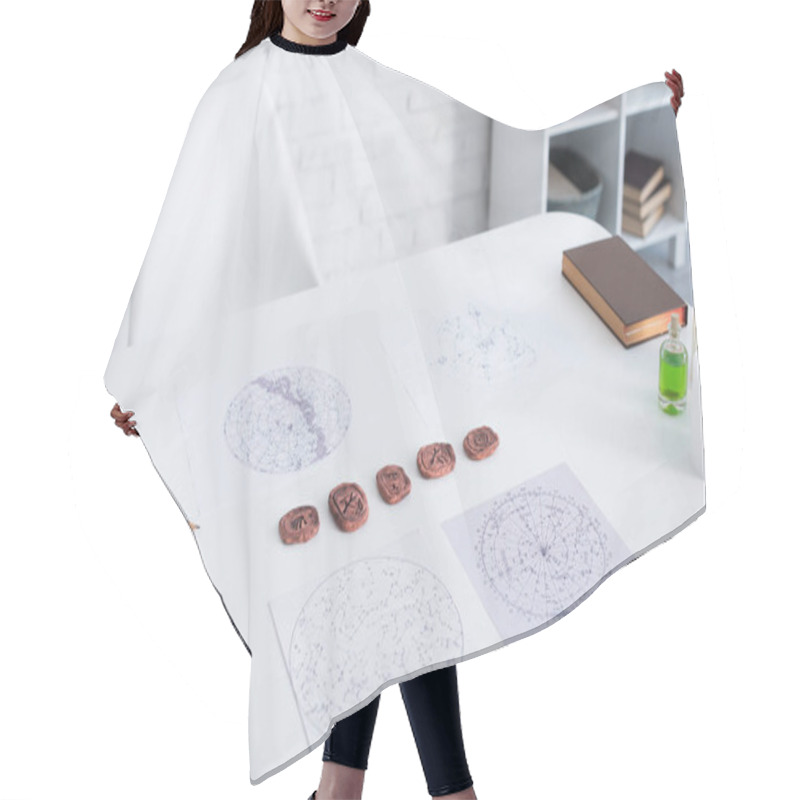 Personality  Astrological Maps And Clay Runes Near Candles And Prediction Book On White Table Hair Cutting Cape