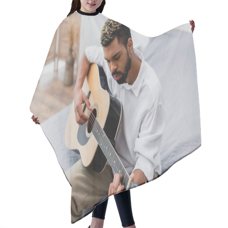 Personality  Young African American Man With Dyed Hair And Beard Playing Acoustic Guitar In Bedroom Hair Cutting Cape