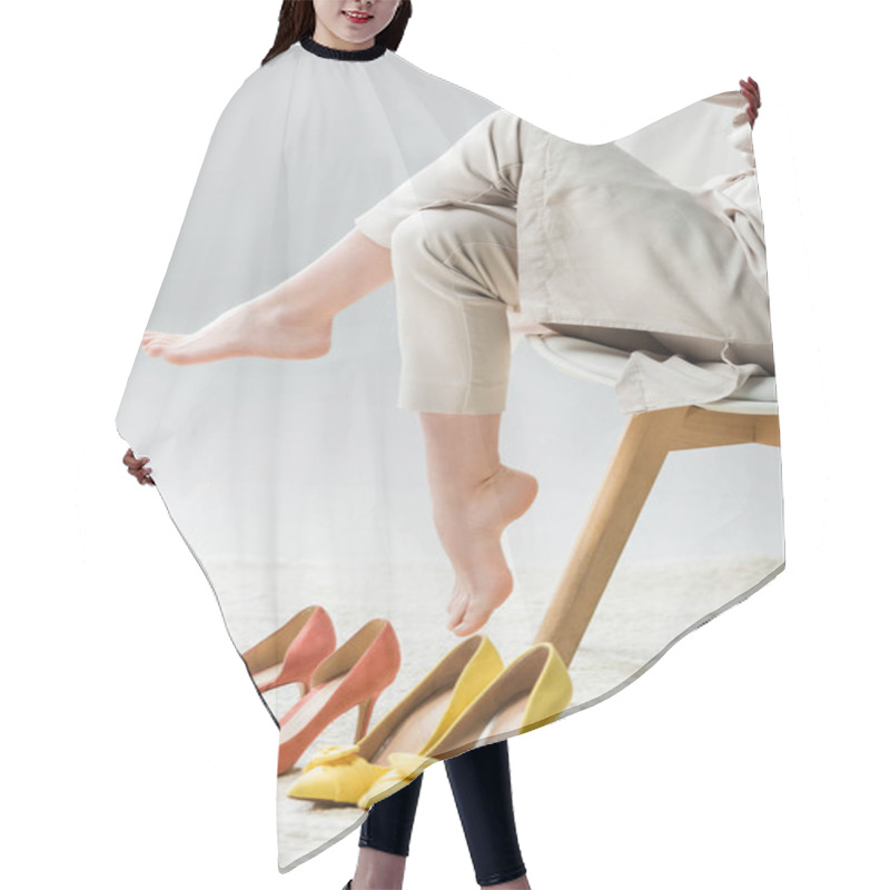 Personality  Cropped View Of Barefoot Girl Sitting On Chair Near Collection Of Shoes On Grey Background Hair Cutting Cape