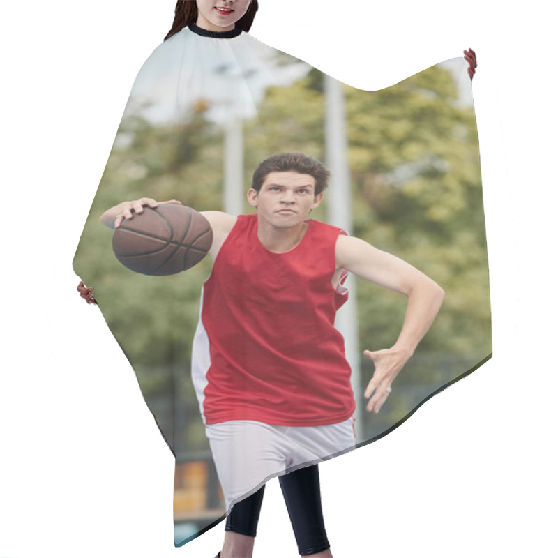 Personality  A Young Man Confidently Holds A Basketball On Top Of A Vibrant Basketball Court Under The Bright Sun Of A Summer Day. Hair Cutting Cape