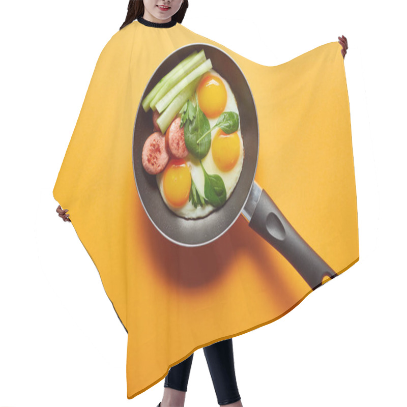 Personality  Top View Of Fried Eggs With Spinach Leaves, Cucumber And Sausage In Frying Pan On Orange Background Hair Cutting Cape