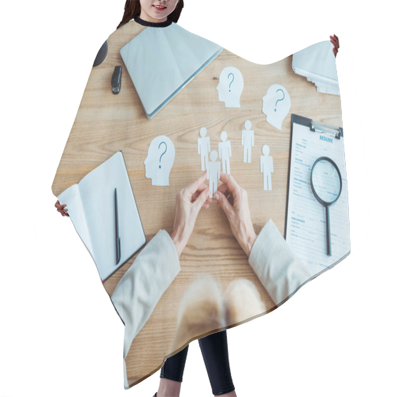 Personality  Cropped View Of Woman Holding Paper Human Shapes Near Table  Hair Cutting Cape