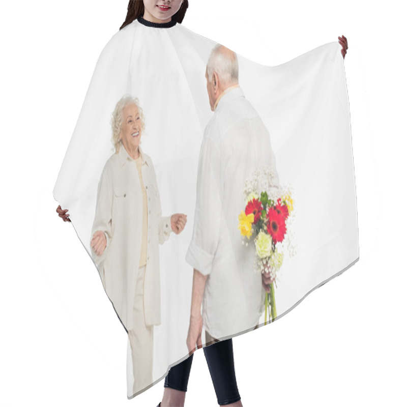 Personality  Elderly Man Hiding Bouquet Of Flowers Behind Back Near Wife With Outstretched Hands On White Hair Cutting Cape