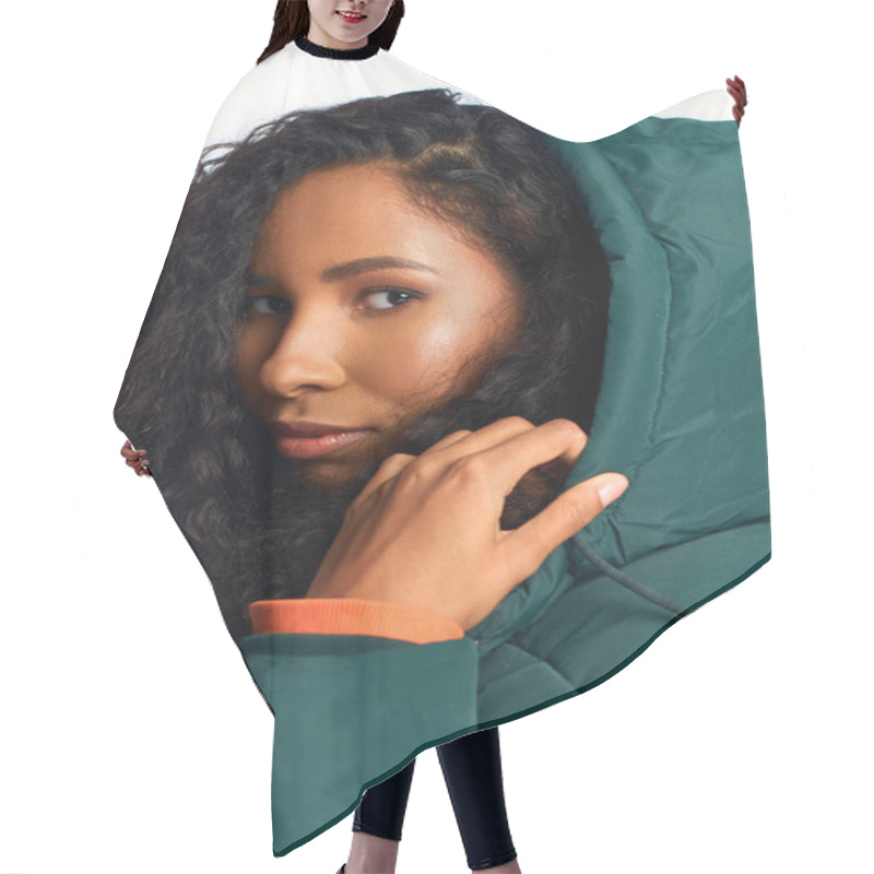 Personality  A Stunning Woman With Curly Hair Gazes Confidently, Wearing A Chic Green Jacket With A Hood. Hair Cutting Cape