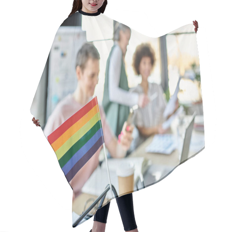 Personality  Focus On Rainbow Flag Displayed On Office Table In Front Of Blurred Dverse Businesswomen. Hair Cutting Cape