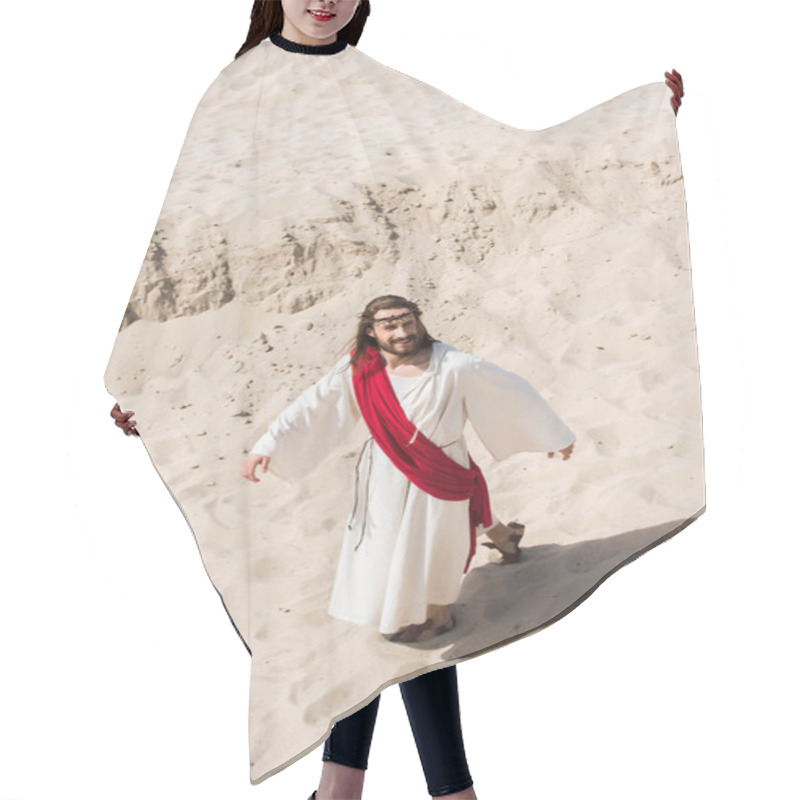 Personality  High Angle View Of Jesus In Robe, Red Sash And Crown Of Thorns Walking On Sand In Desert Hair Cutting Cape