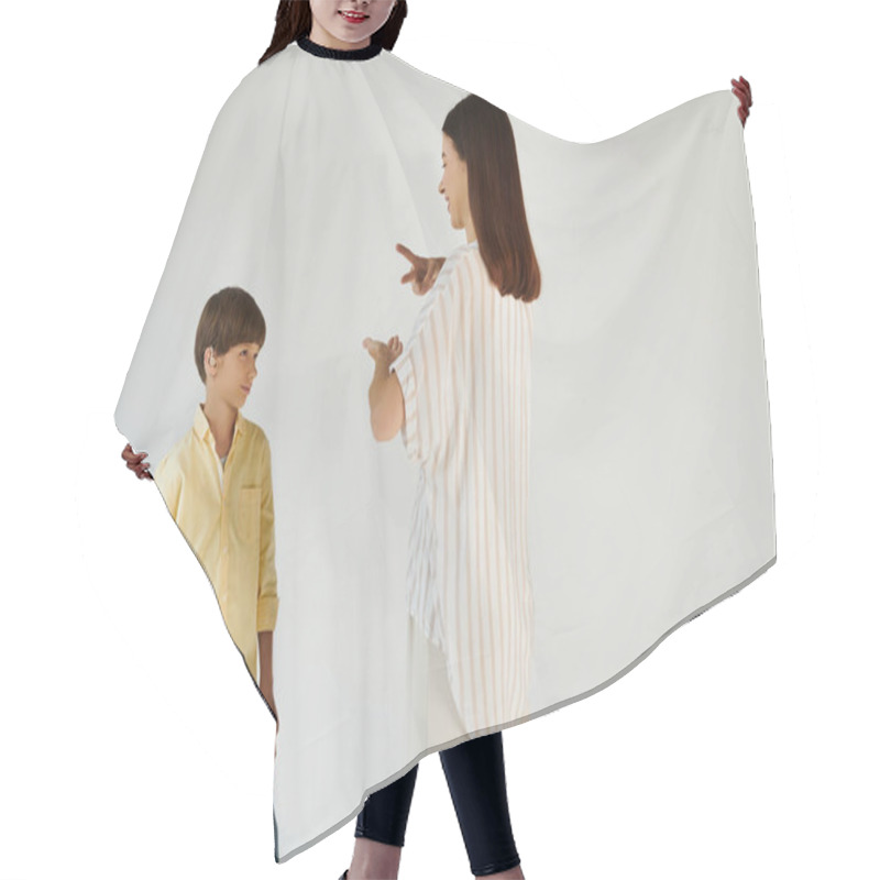 Personality  A Mother Communicates With Her Young Son Who Has A Hearing Impairment, Sharing A Special Bond. Hair Cutting Cape