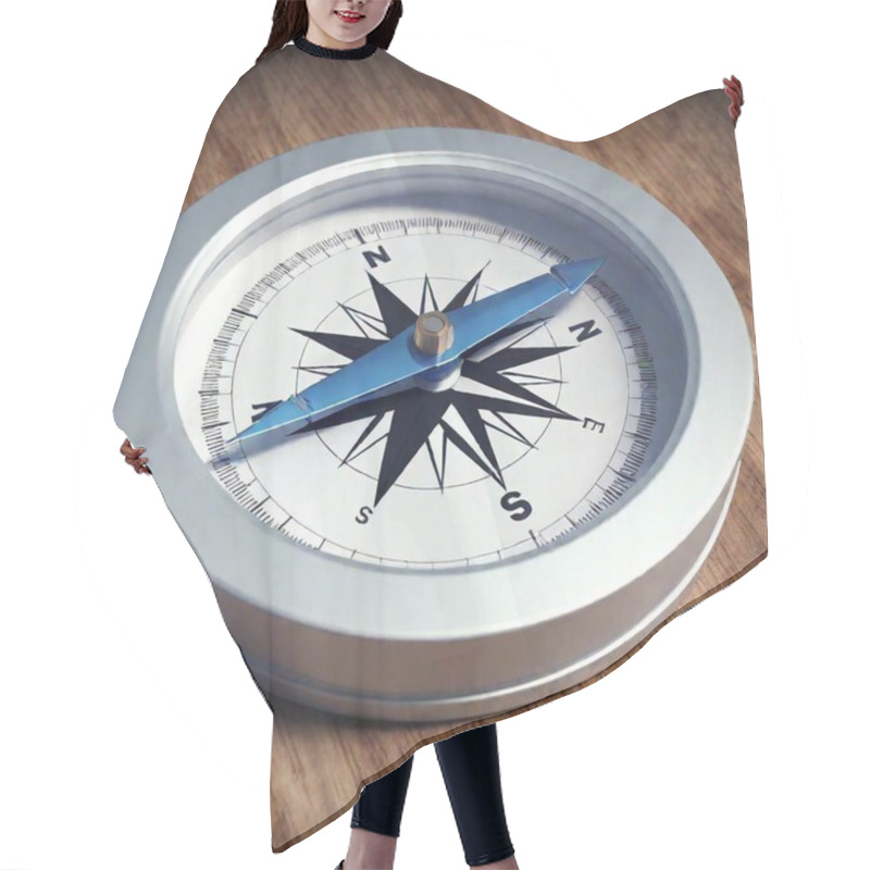 Personality  A High-resolution Digital Artwork Of A Close-up Compass. The Detailed Compass Features A Sleek, Modern Design With A Metallic Silver Pointer And Intricate Blue Directional Markers. The Compass Rests Against A Textured, Light-wood Surface, Adding A Hair Cutting Cape