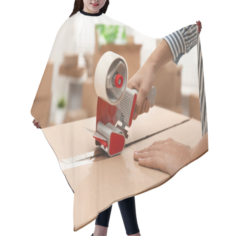 Personality  Woman Packing Cardboard Box Indoors, Closeup. Moving Day Hair Cutting Cape